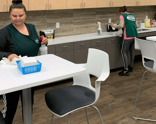 Rangel crew member vacuuming office carpet